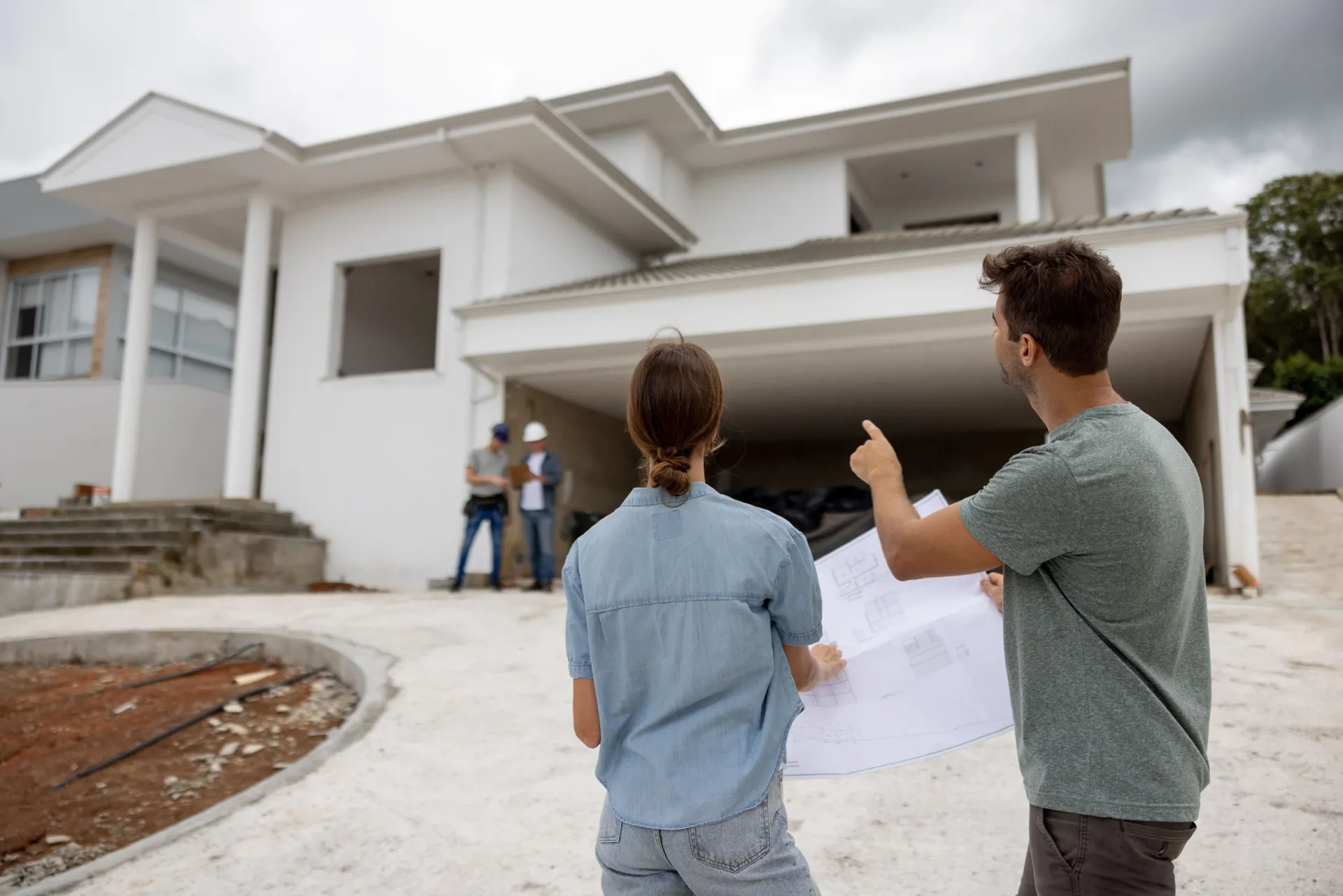 people looking at house construction