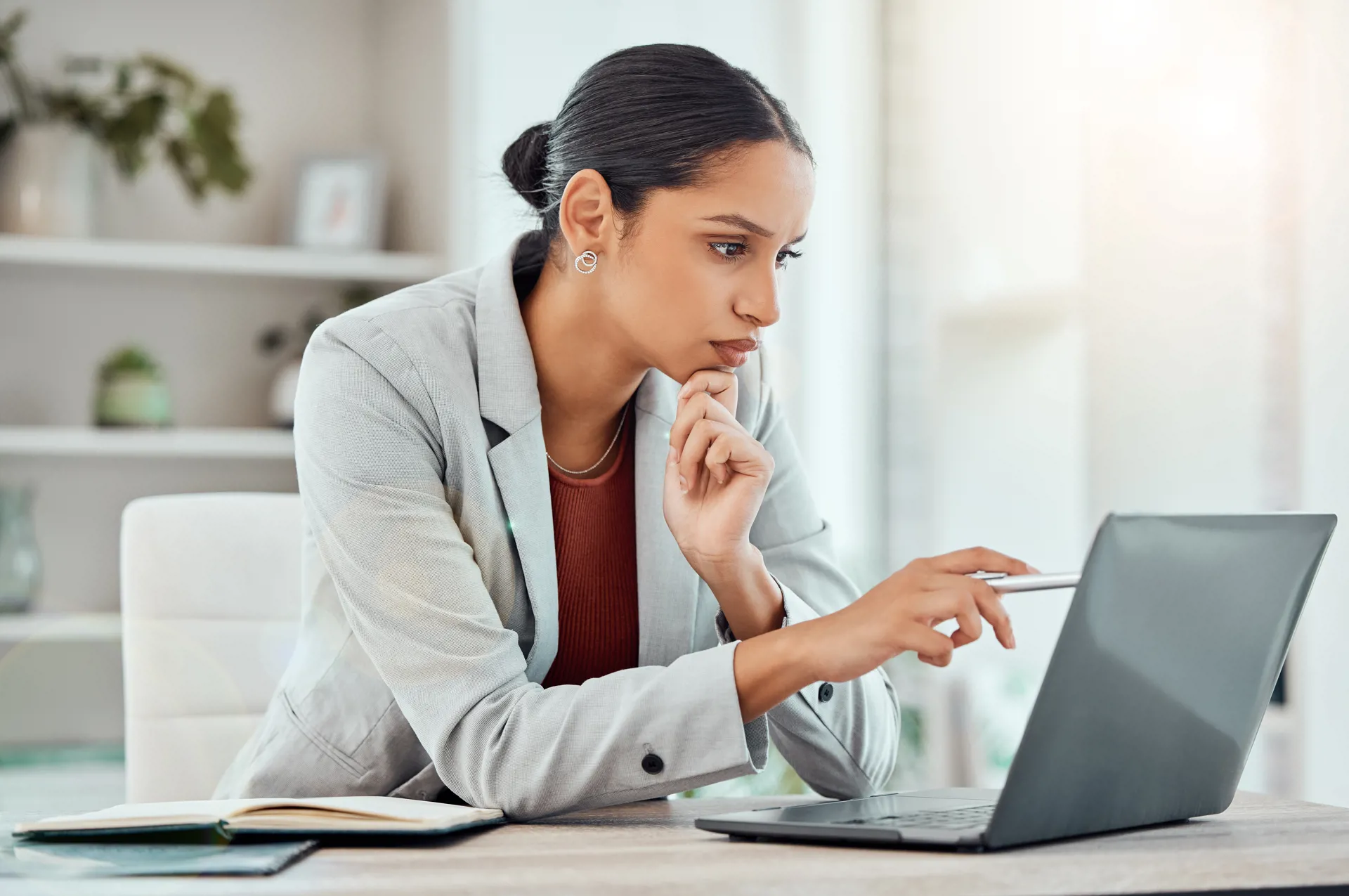 person thinking at computer