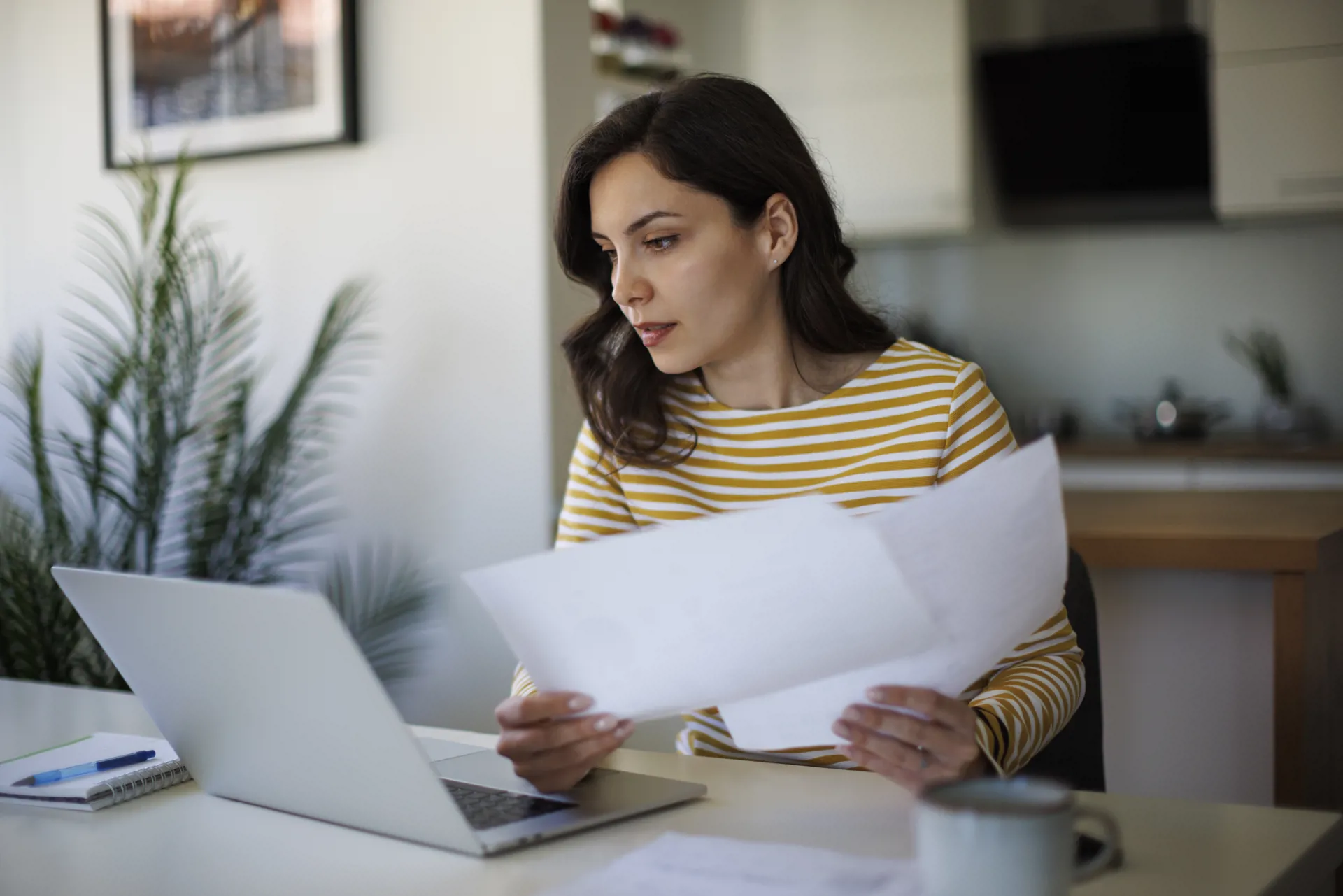 woman looking at paperwork