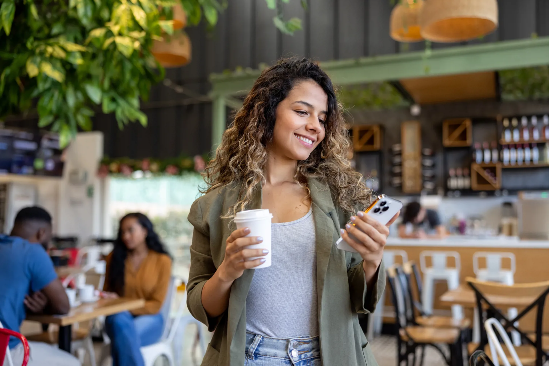 Happy woman looking at benefits on her phone