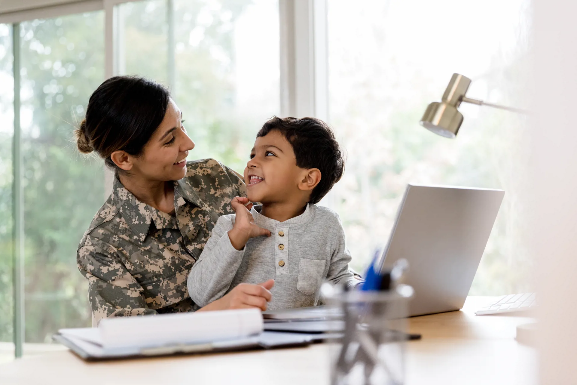 mother and son looking at computer