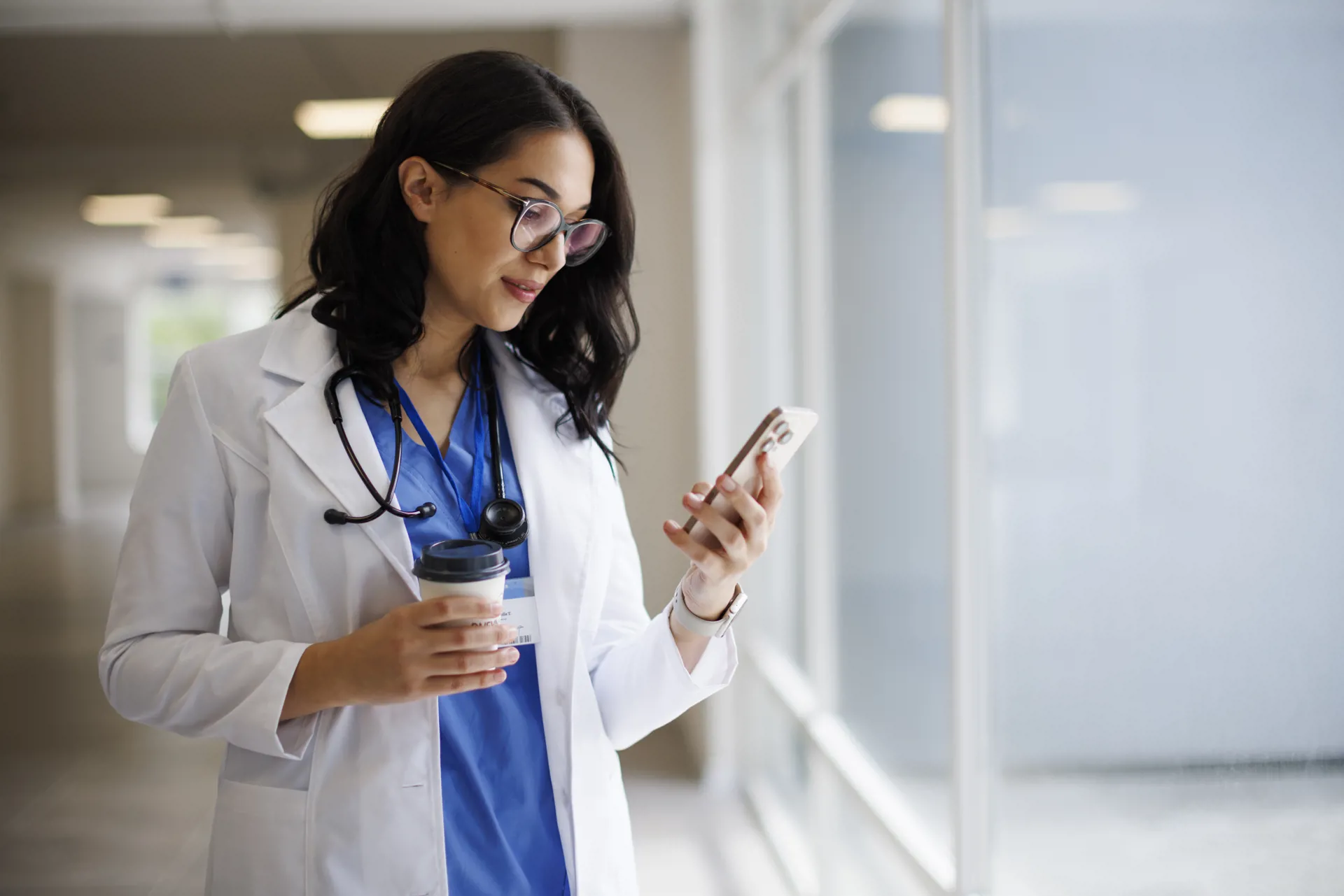 Doctor looking at phone